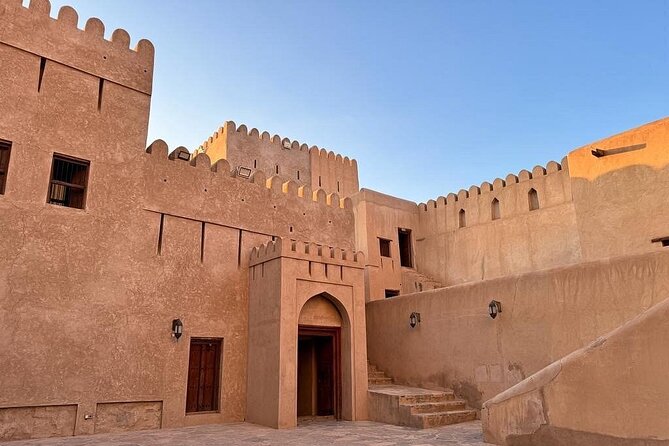 Amouage & Nizwa Full-Day Tour: Fort, Souq & Barakat Al Mouz - Muscat pickup and how the tour day is paced
