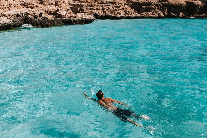 Dimaniyat Island Tour on Glass Bottom Boat (Muscat) - The Main Stop at Ad Dimaniyat Islands: Snorkeling, Swimming, and Sea Turtles