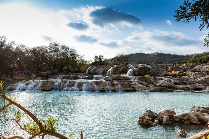East & West Salalah Combination Tour - Darbat Waterfall, Mughsail - Haffah: coconut farms, fresh milk, and Al Husn Souk