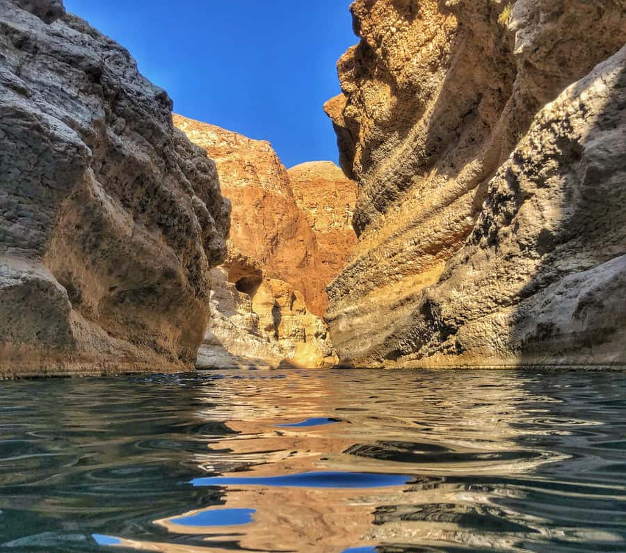 From Muscat: Wadi Shab & Bimmah Sinkhole Full-Day Tour - The boat crossing and 40-minute hike through Wadi Shab’s canyon