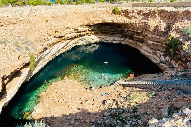 Full Day Group Tour to Wadi Shab Bimmah Sinkhole and Fins Beach - Getting There Smoothly: 4WD, small-group size, and an 8 to 9 hour day