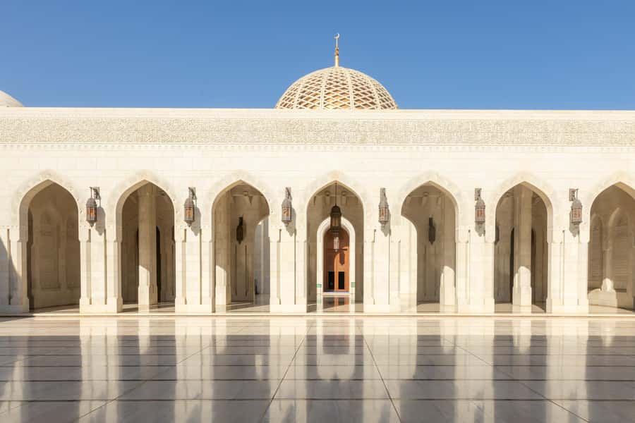 Guided Walking Tour of Sultan Qaboos Grand Mosque in Muscat - Inside the Main Prayer Hall: Carpet, Chandelier, and Wall Art With Meaning