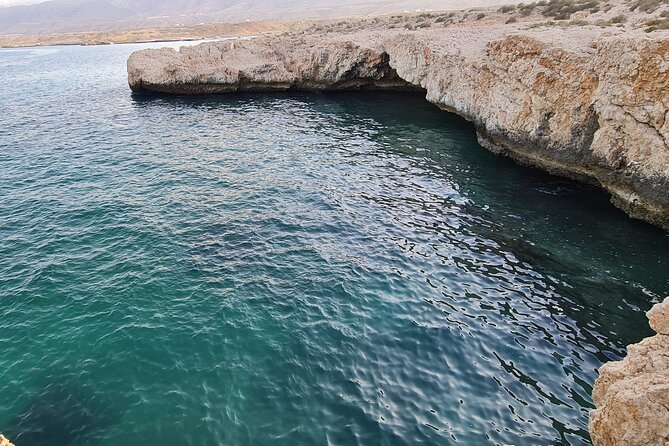 Hidden Gems of Oman: Sinkhole, Fins Beach & Wadi Tiwi Adventure - Fins Beach in Muscat: White Pebbles and a Serious Blue Sea