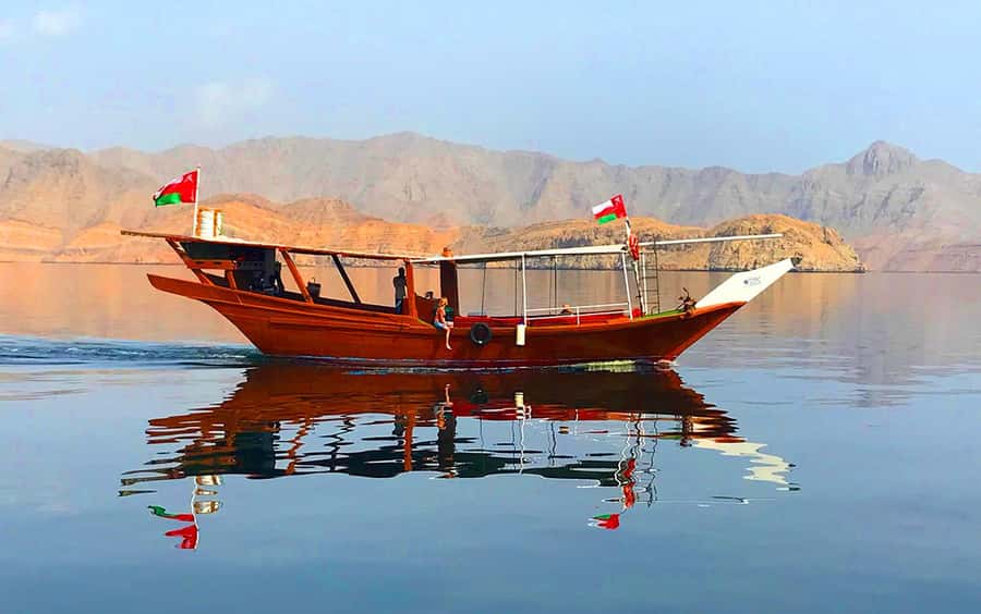 Khasab: Dolphin Watching Day Tour with Snorkeling & Lunch - Riding a traditional Omani dhow through the Musandam fjord