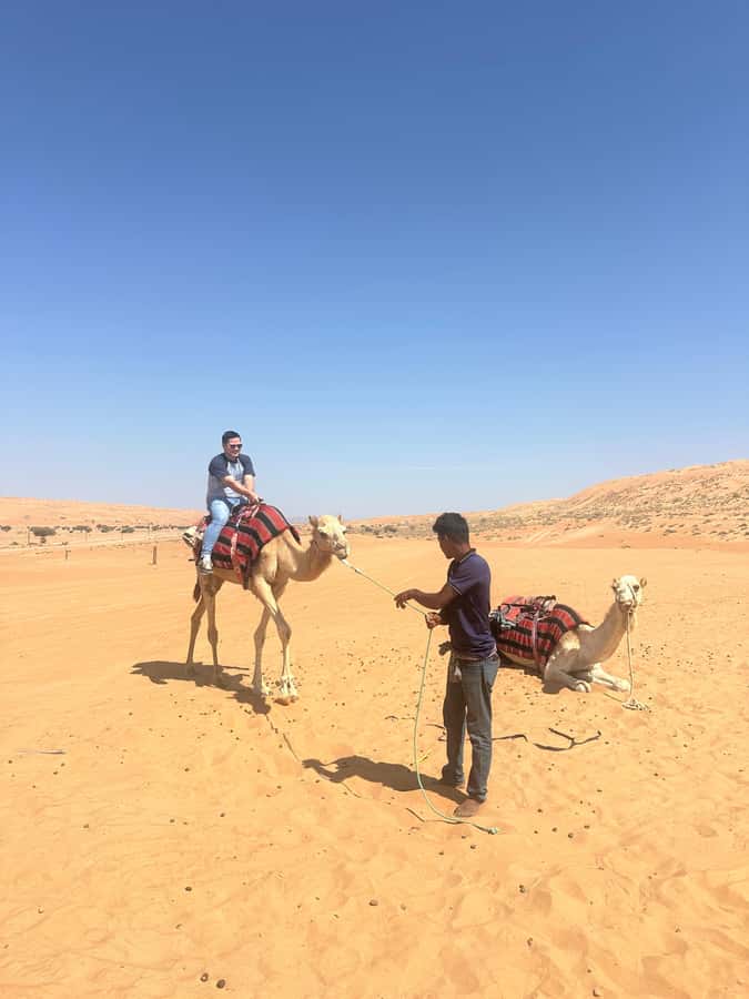 Muscat: Bidiya Desert Sunset Camel Ride with Transfer - What to bring, what not to do, and how to stay comfortable