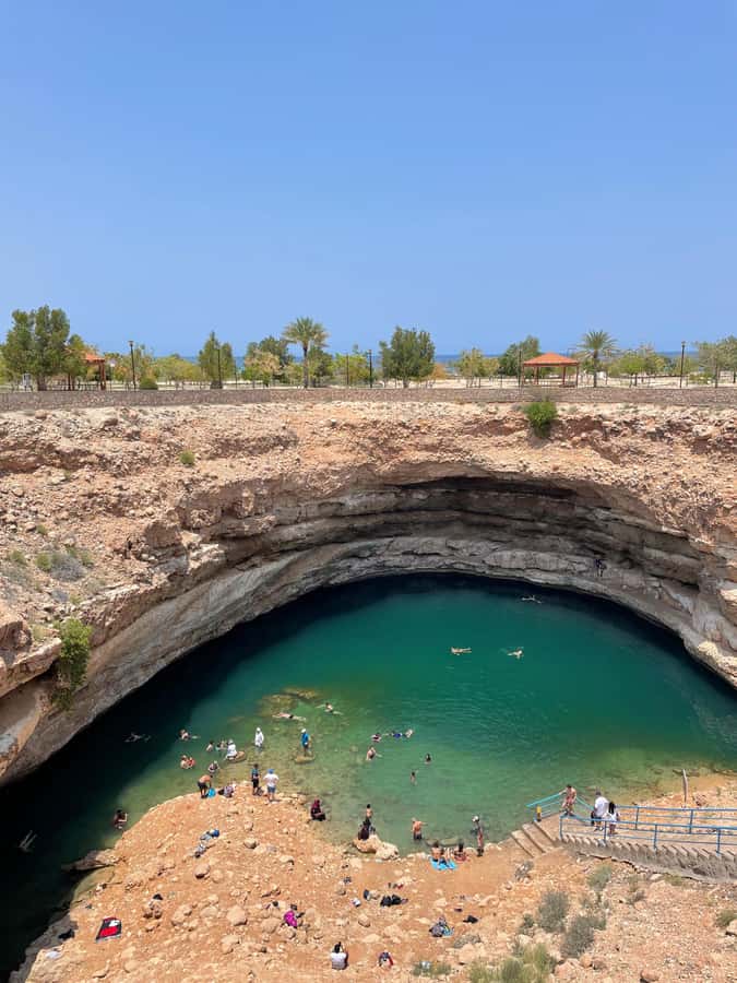 Muscat: Full-Day Wadi Shab & Bimmah Sinkhole Private Tour - Wadi Shab hike: cliffs, pools, waterfall goals, and cave access