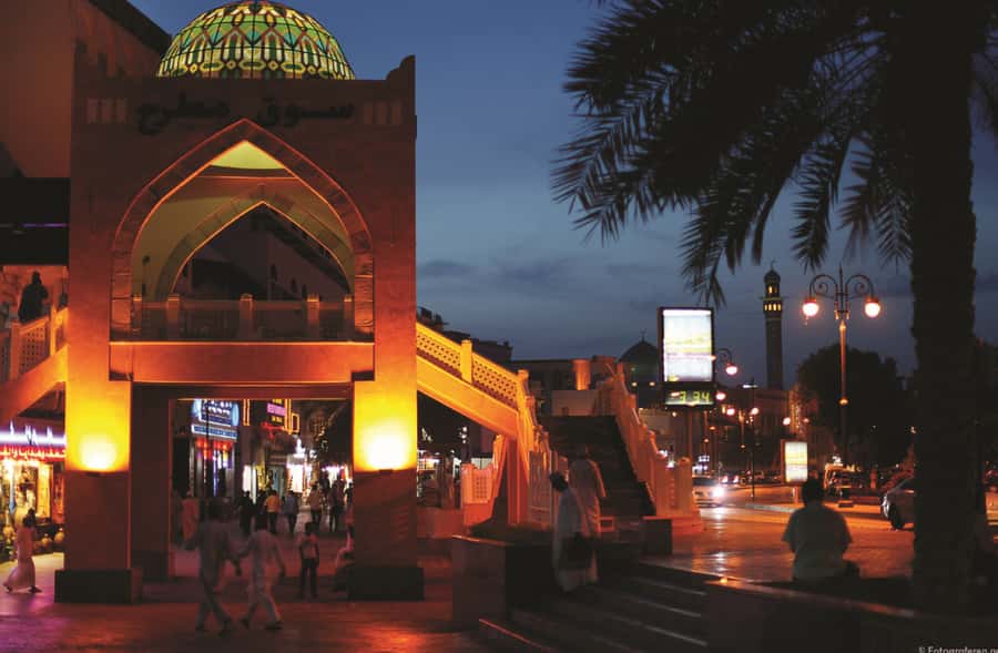 Muscat Nights: Local Dinner & City Lights from Muscat - Corniche harbor views and Muttrah Souq after sunset
