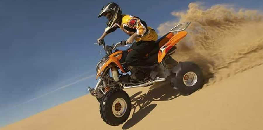 Muscat:Optional Quad Bike with Sunset Watching, Pickup&BBQ - Quad biking on Muscat’s red dunes: what you’re actually doing and how to handle it