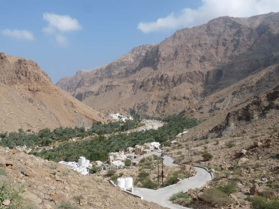 Muscat: Wadi Mibam Private Full Day Tour by 4x4 car - Wadi Mibam hike and swim: waterfall views, rock steps, and turquoise pools