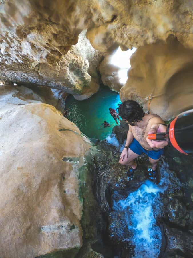 Muscat: Wadi Shab & Bimmah Sinkhole Tour with Pickup & Lunch - Swimming in Wadi Shab: When the Water Turns the Day Fun