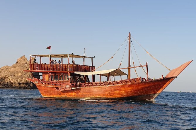 Omani Traditional Dhow Cruise: Sunset and Muscat Coastal View - What Boarding Feels Like: Clean Dhow, Friendly Crew, and a Possible Helm Moment