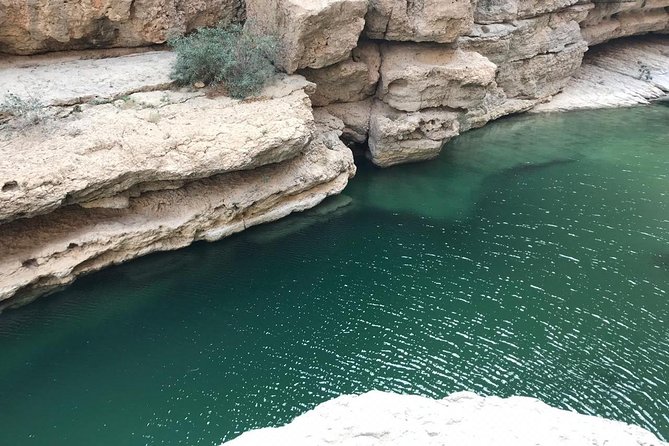 Private Day Trip to Wadi Shab, Fins Beach & Bimmah Sinkhole - Bimmah Sinkhole: A Protected Park With a Turquoise Lake and Swimming Possible
