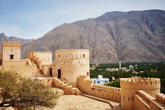 Private Half-Day Tour to Grand Mosque-Nakhal Fort and Hotspring - Stop 2: Nakhal Fort museum, historic guns, and views worth the climb