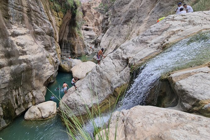 Private Wadi Tiwi - Bimmah Sinkhole - White Sand Beach - Full Day Tour - Stop 1: Wadi Tiwi, the Greener Wadi Where Swimming and Picnic Feel Natural