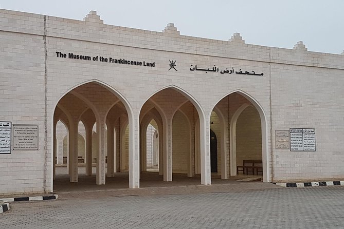 Salalah City Tour with History, Culture, Souq Shopping, Halwa - Al Haffa Beach: white sand, coconut trees, and shop-lined beachfront