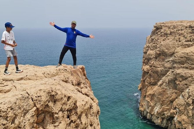 Sinkhole, Fins & Wadi Tiwi Explorer: Swim, Hike & Scenic Views - Fins Beach: cliffs, white sand, and a good ending vibe